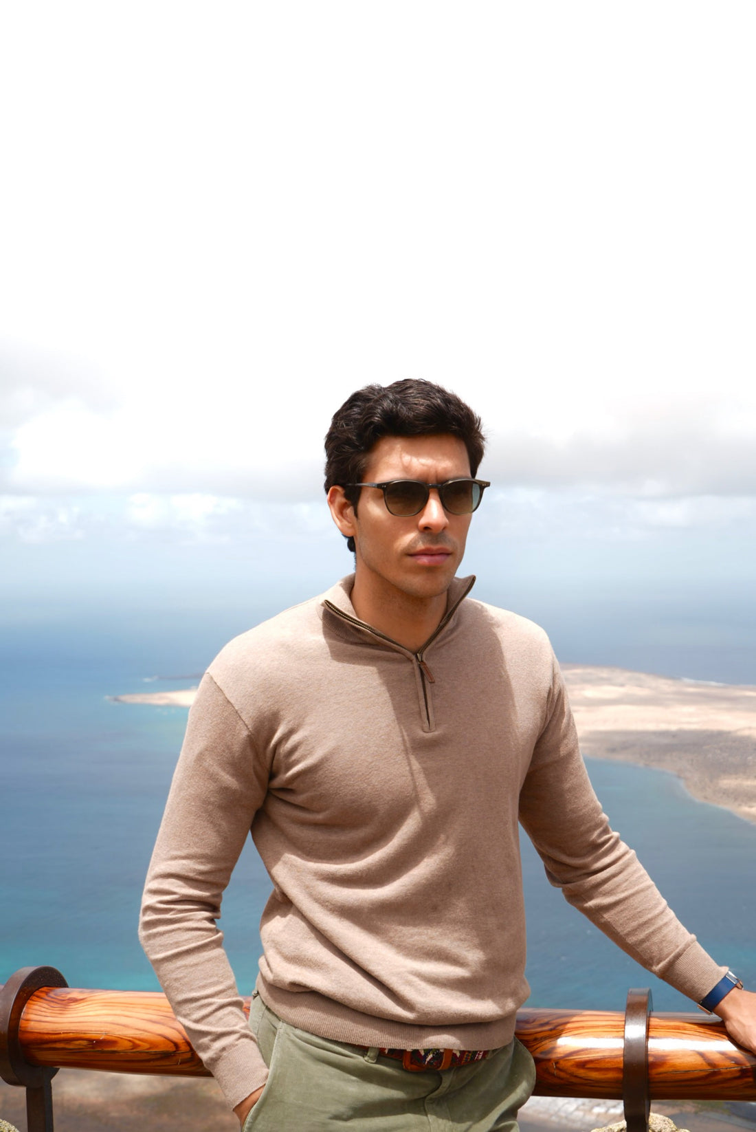 Man wearing Di Capo sunglasses outdoors by the coast